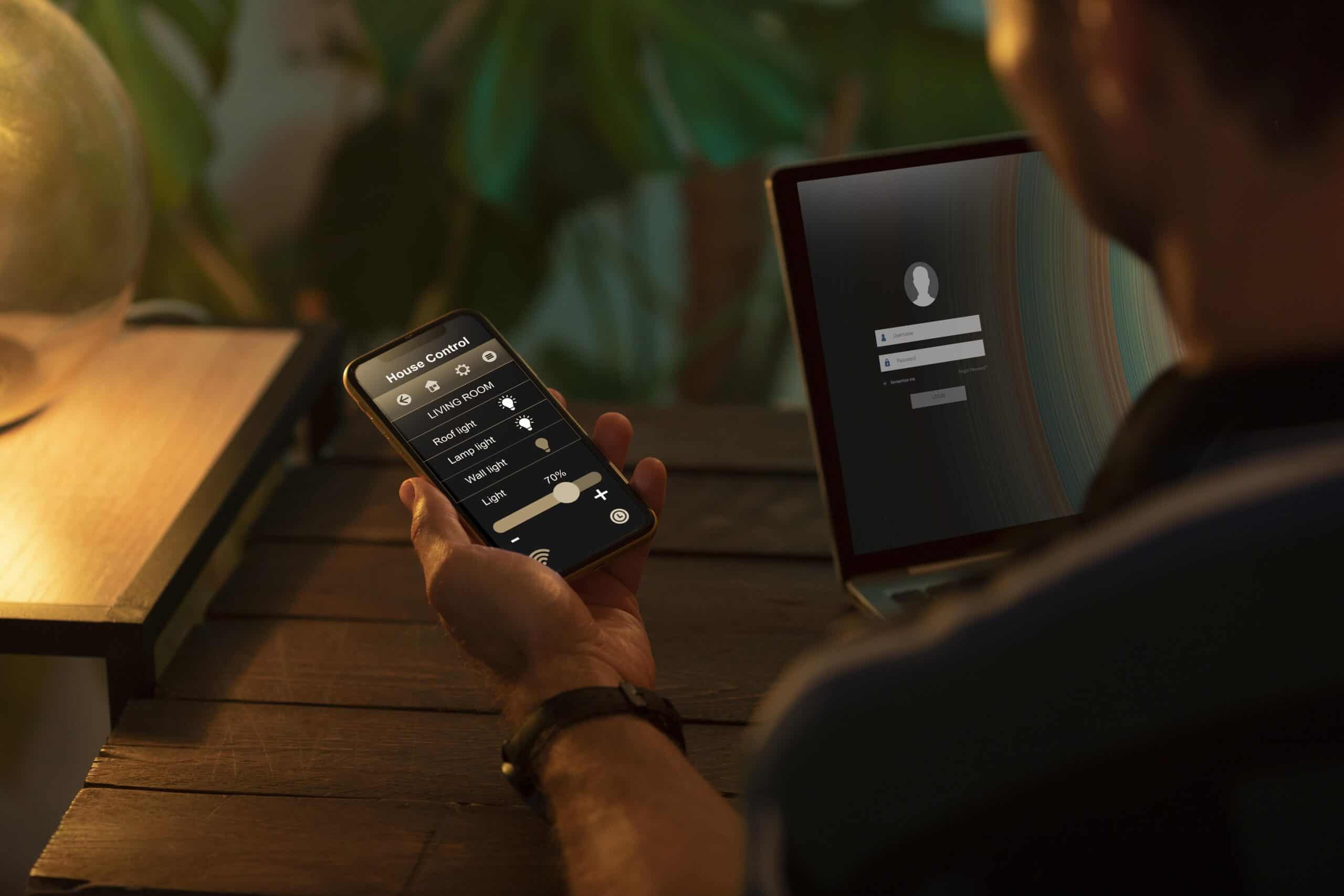 person-using-smartphone-his-automated-home (1)